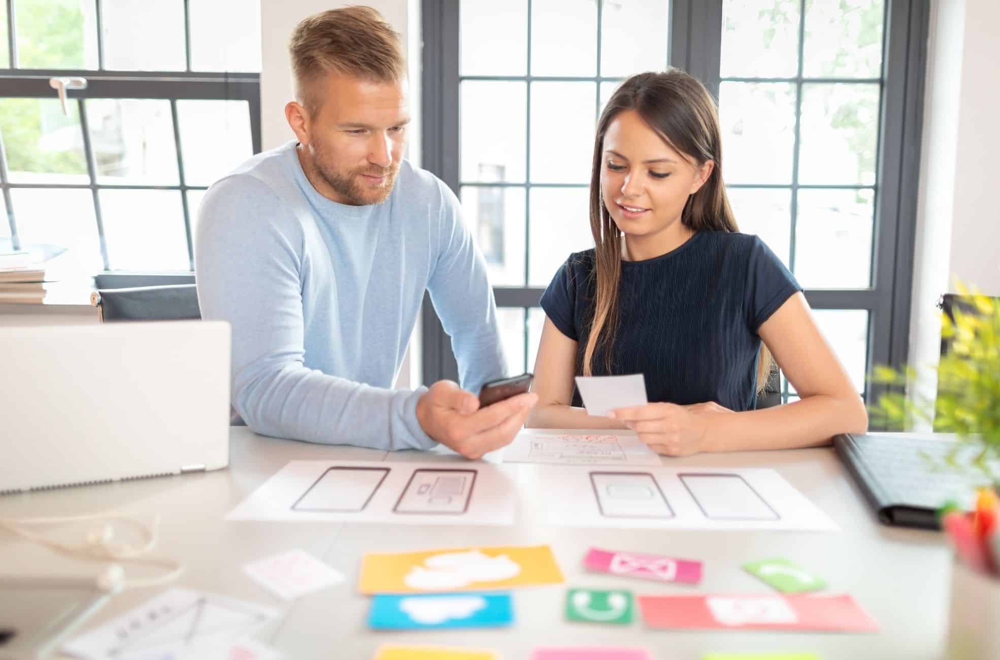 Man And Woman Working In App Development