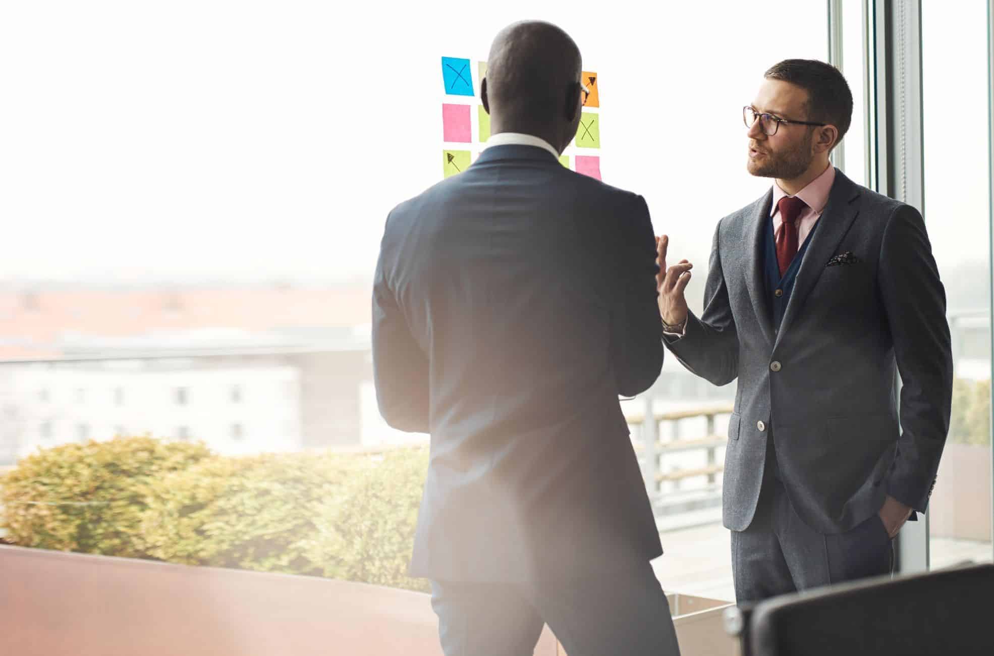 Business Men At Window