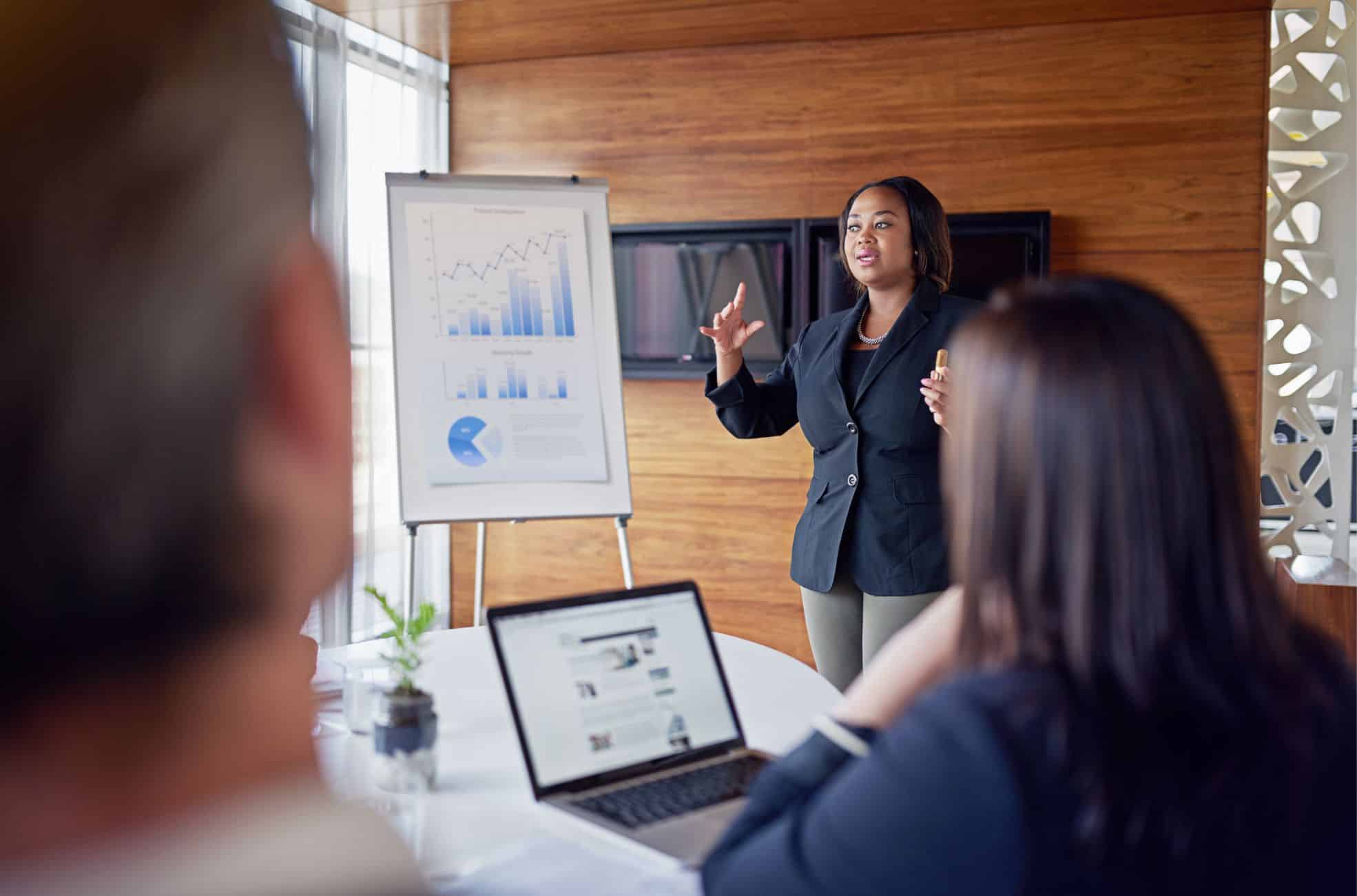 Woman Presenting Business Model To People