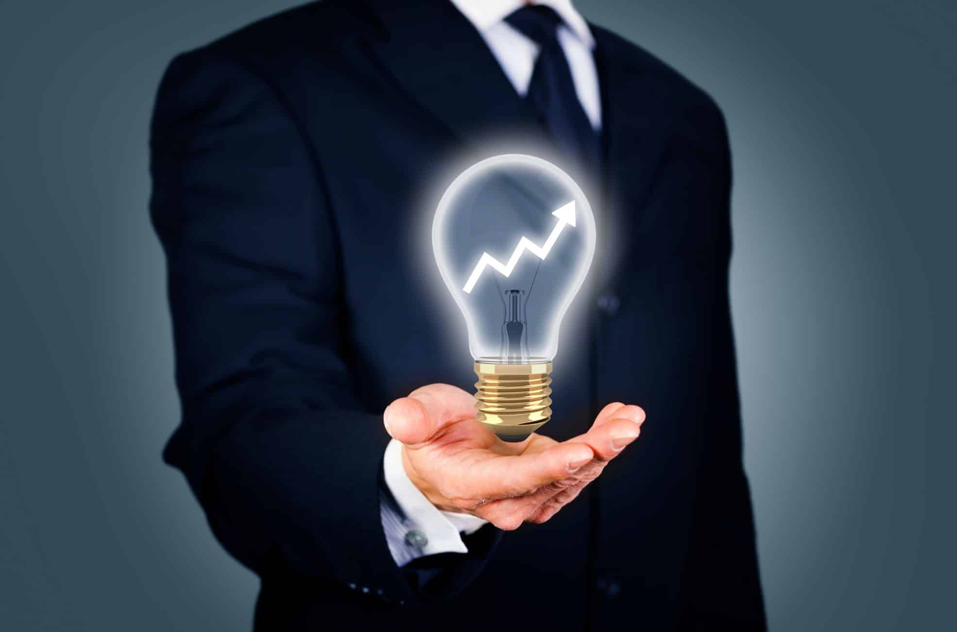 Business Man Holding Lightbulb