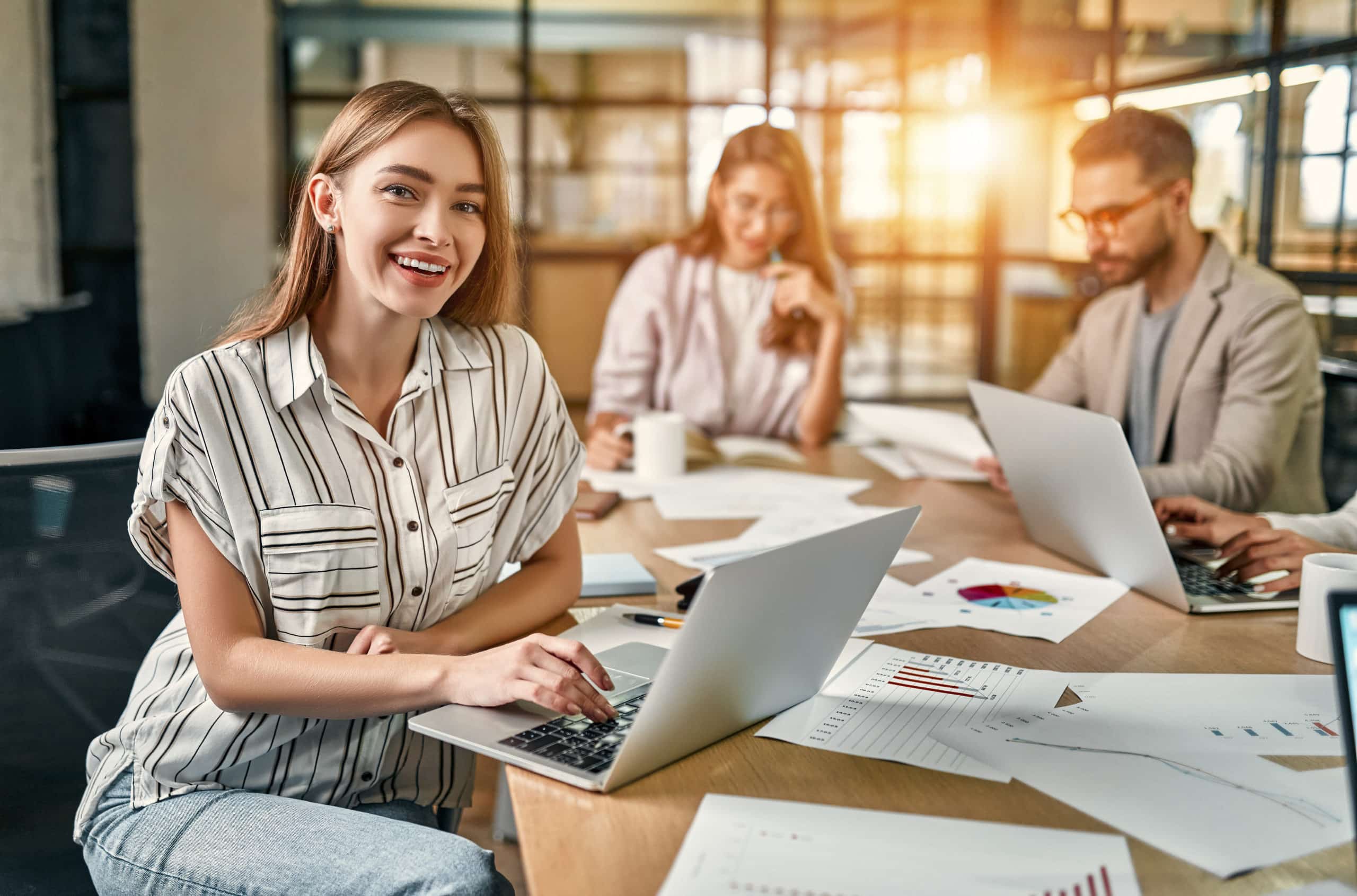 Business owners in a meeting room using Flexi Desk set up in a Dubai free zone.