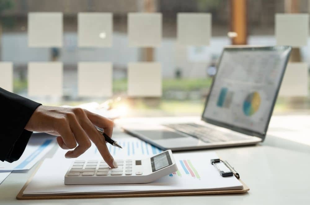 Accountant Working With Calculator