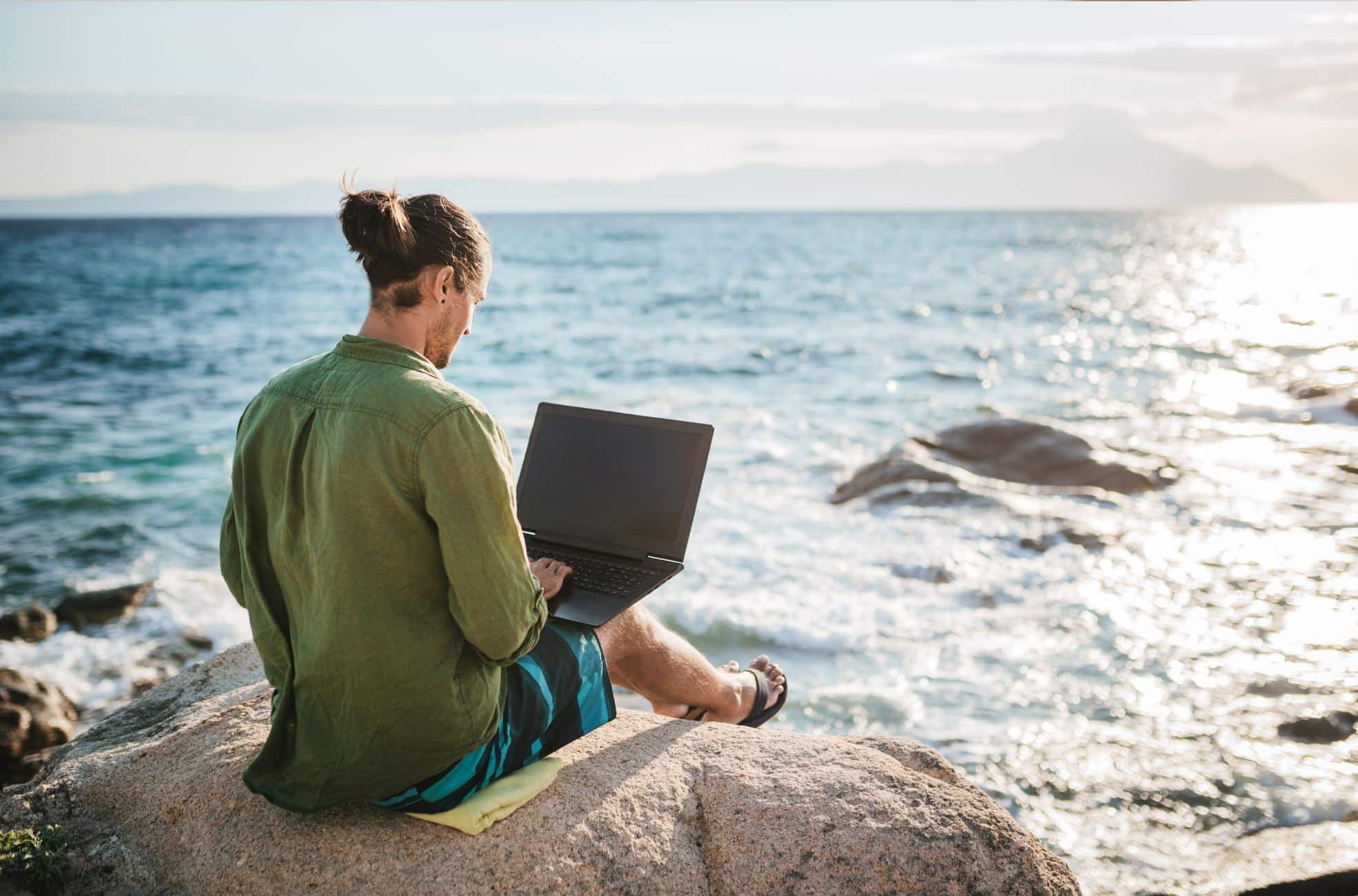 Digital Nomad Working On Beach