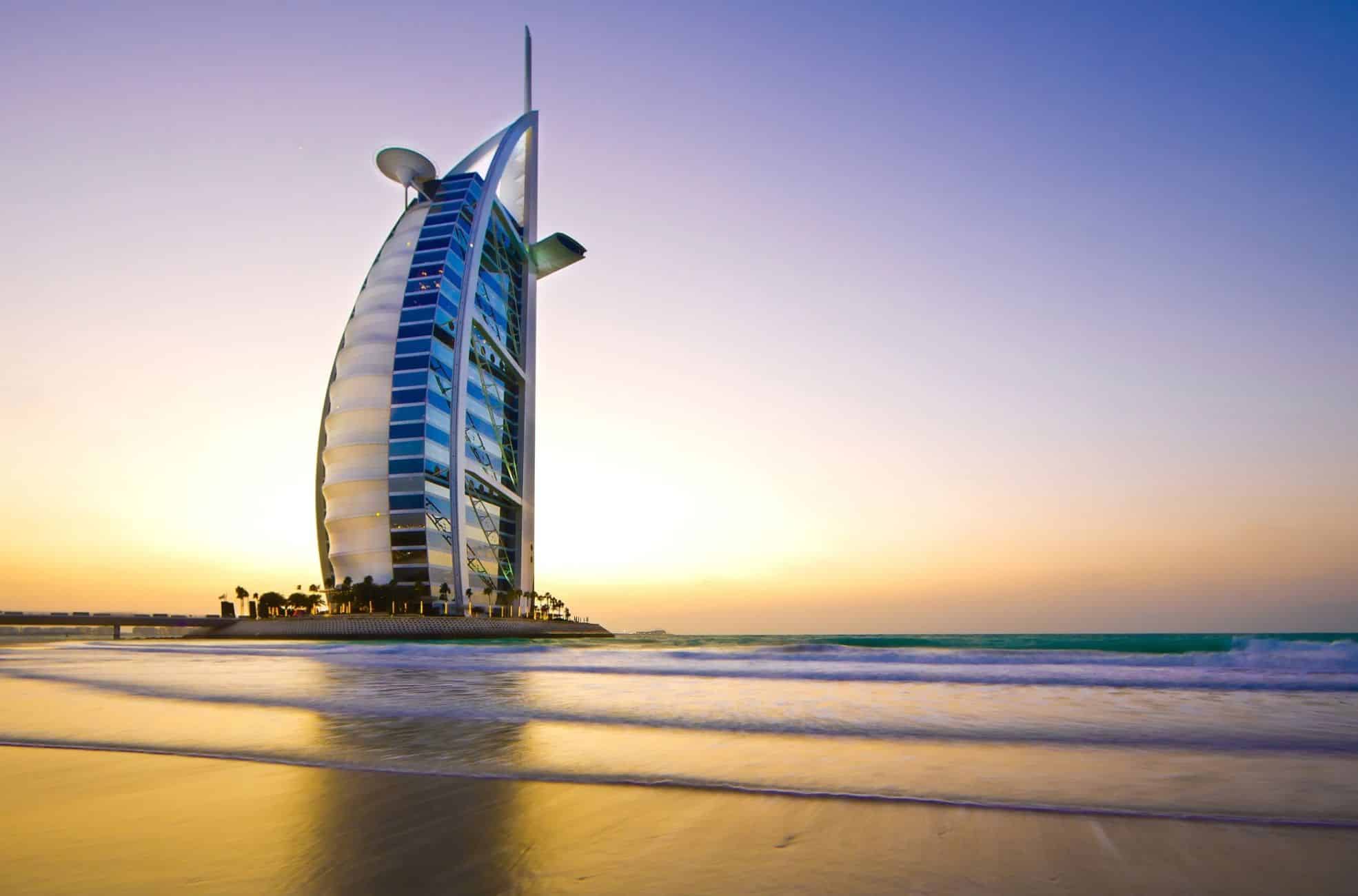 Sunset Over Beach And Building In Dubai