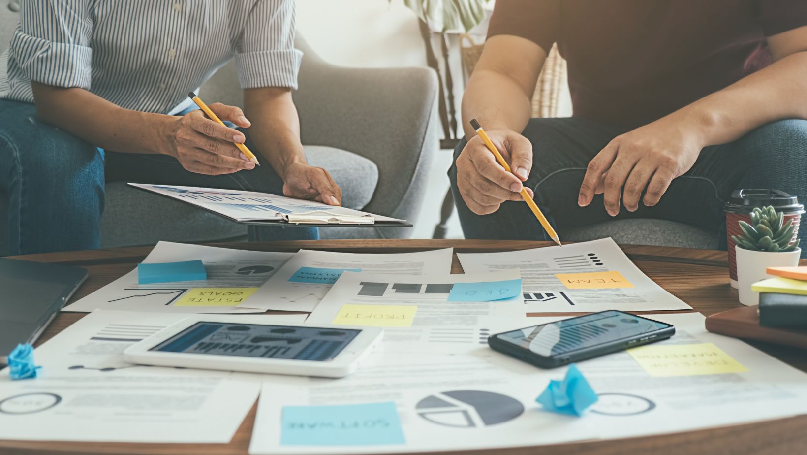 People Reviewing A Business Plan