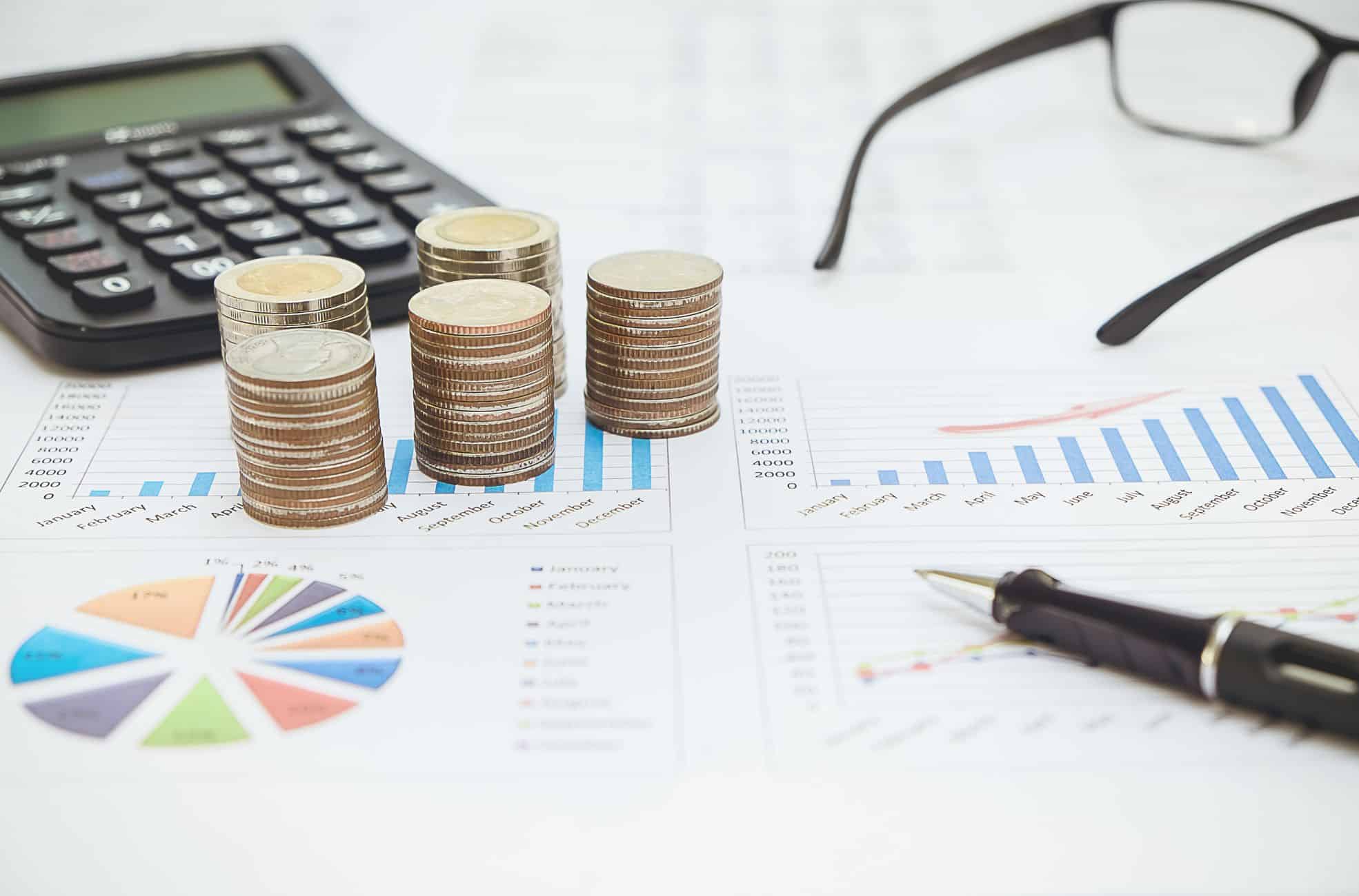 Financial Statements, Calculator, Glasses And Coins
