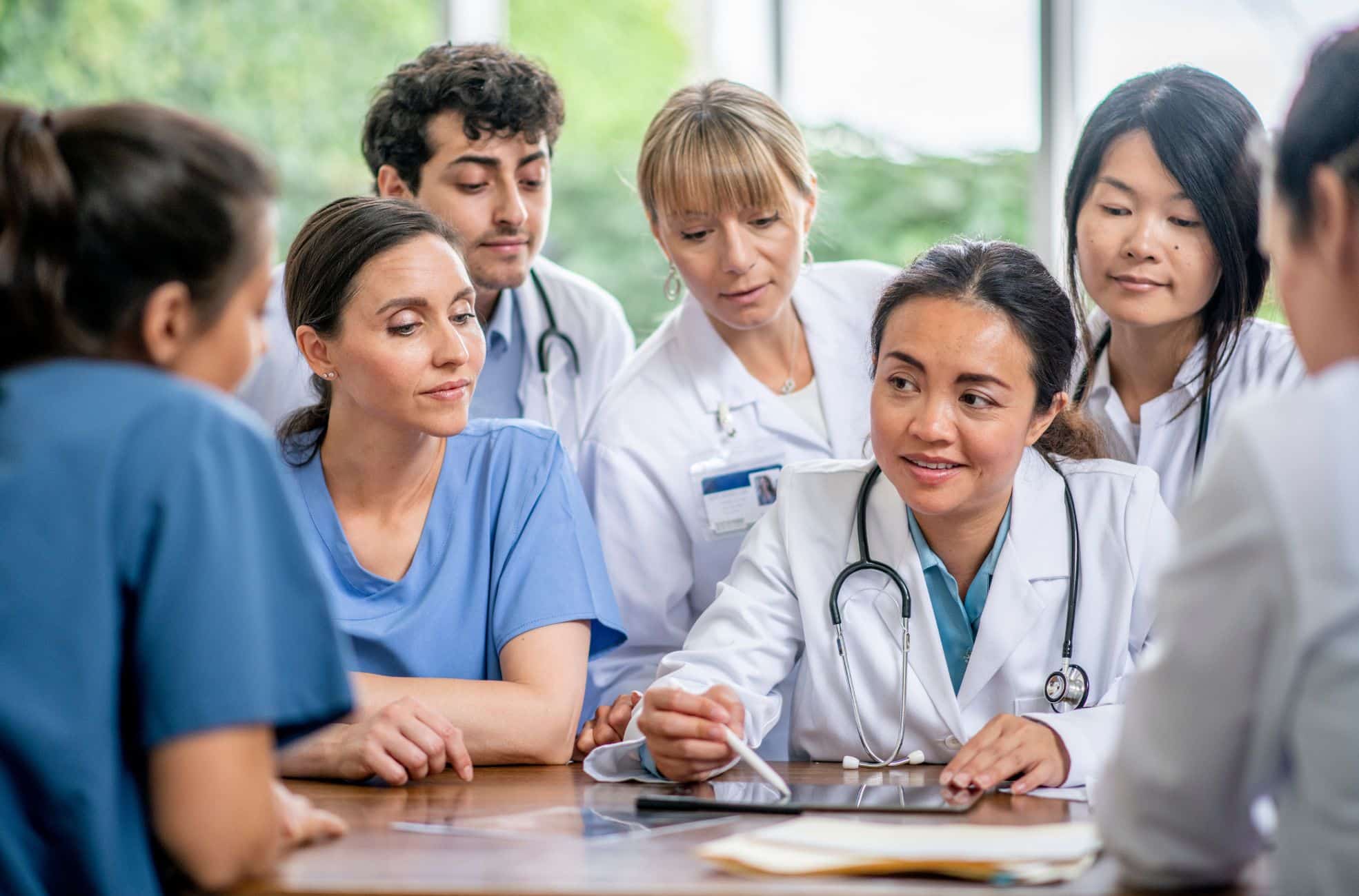 A group of doctors applying for their DHA licence renewal.