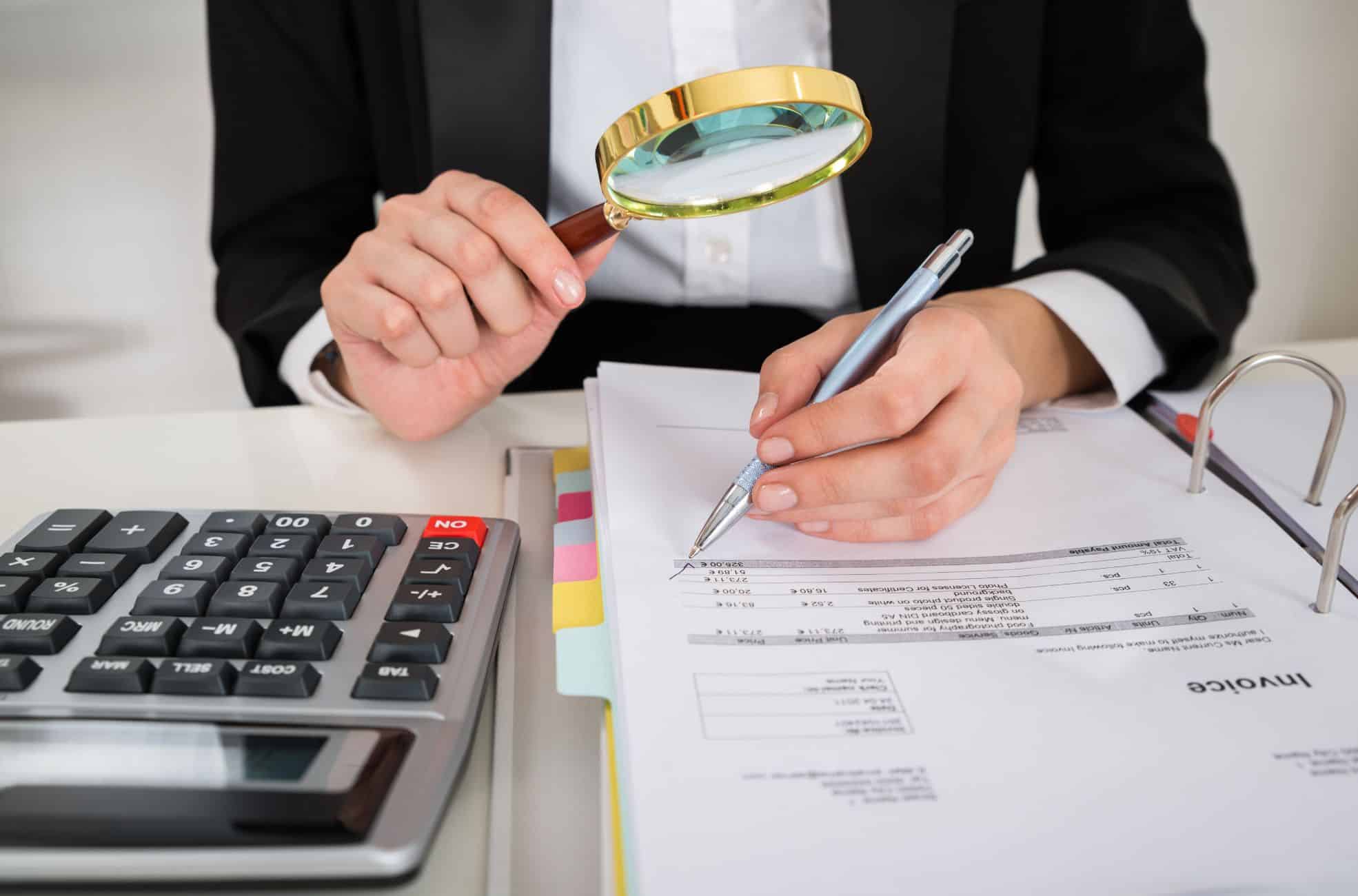 Man At Desk Doing Audit Work