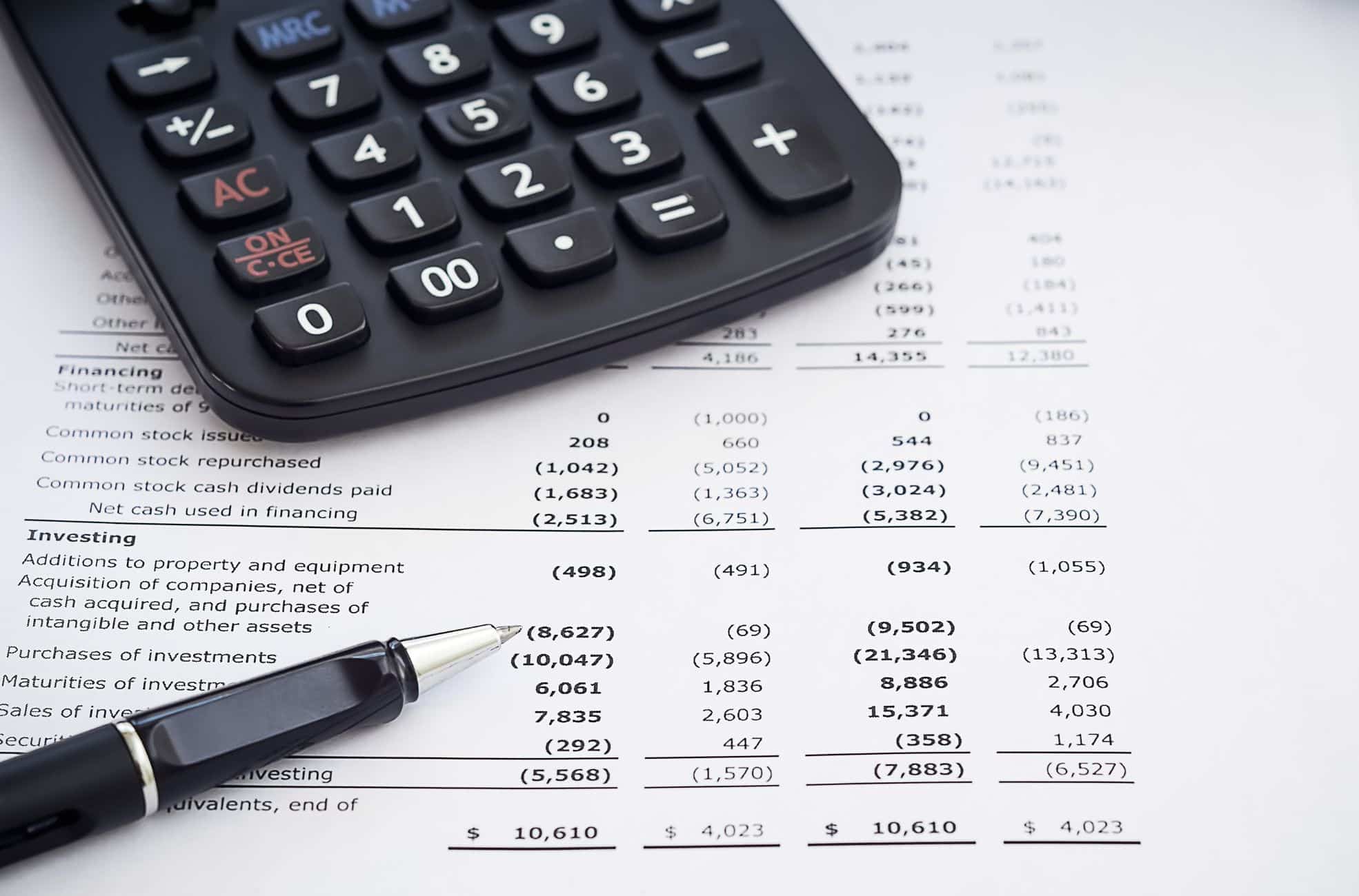 Accounting And Expenses Being Tracked Manually With Calculator