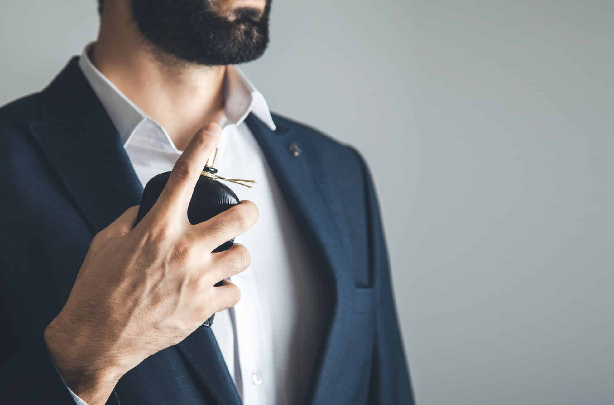 Business Man Spraying Perfume