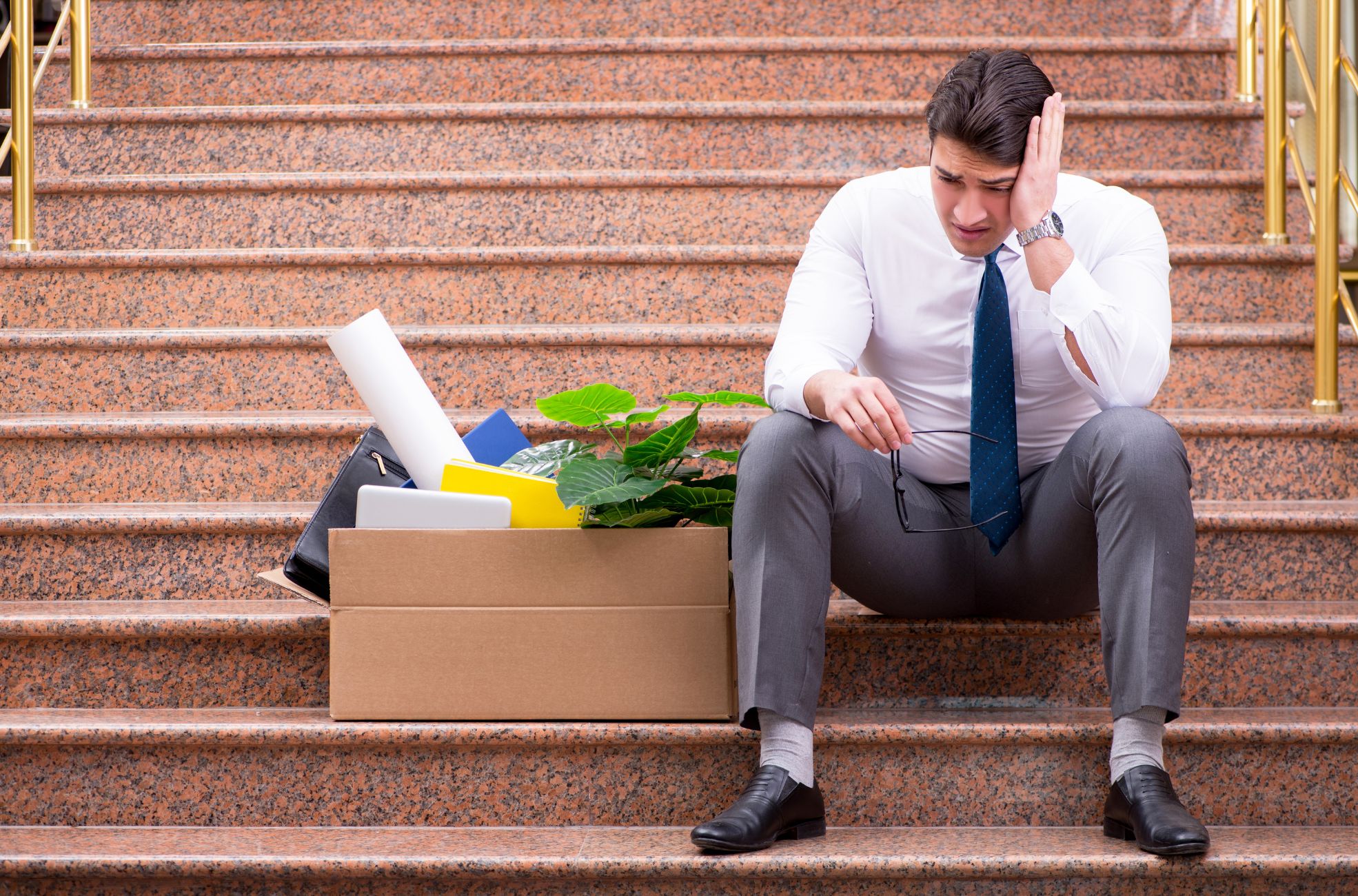 A businessman who just lost his job and is eligible to make a claim with ILOE insurance.