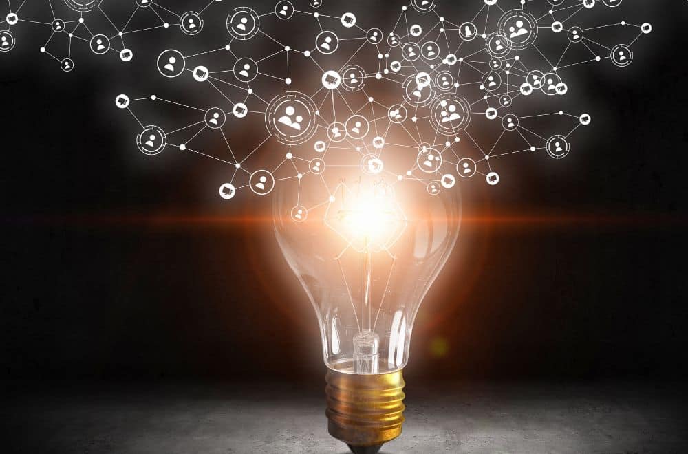 Lightbulb With Business Icons Coming Out From It