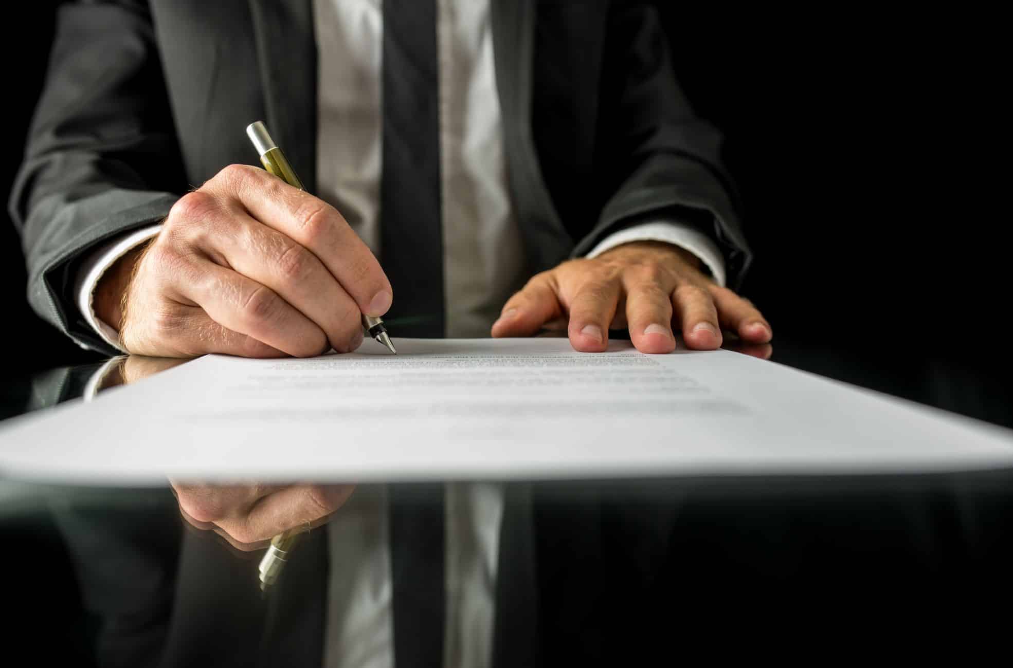 Man Filling Out Paperwork