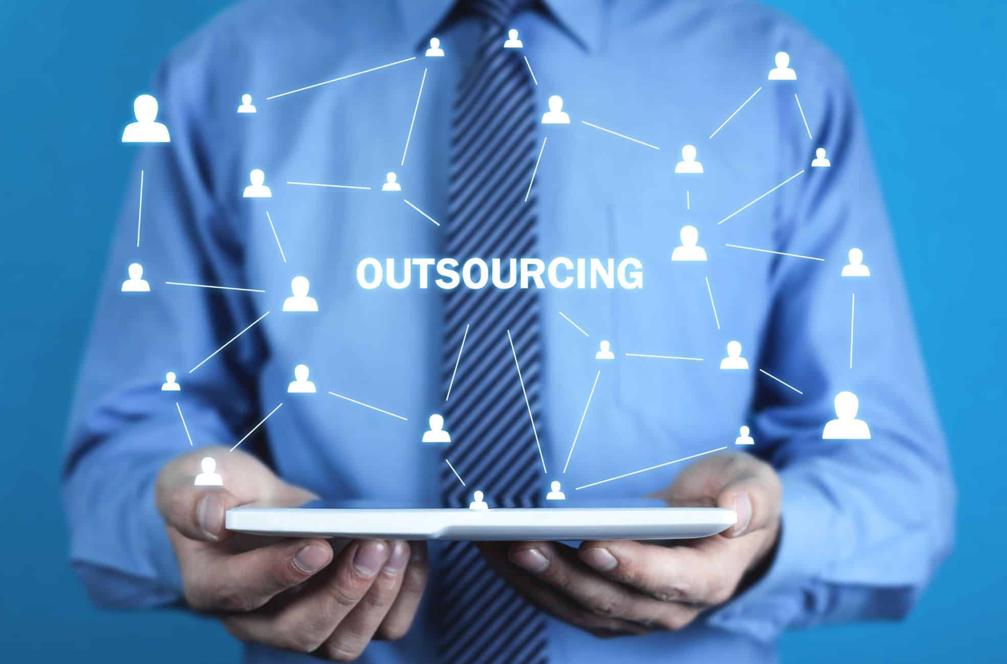 Businessman Holding Outsourcing Diagram