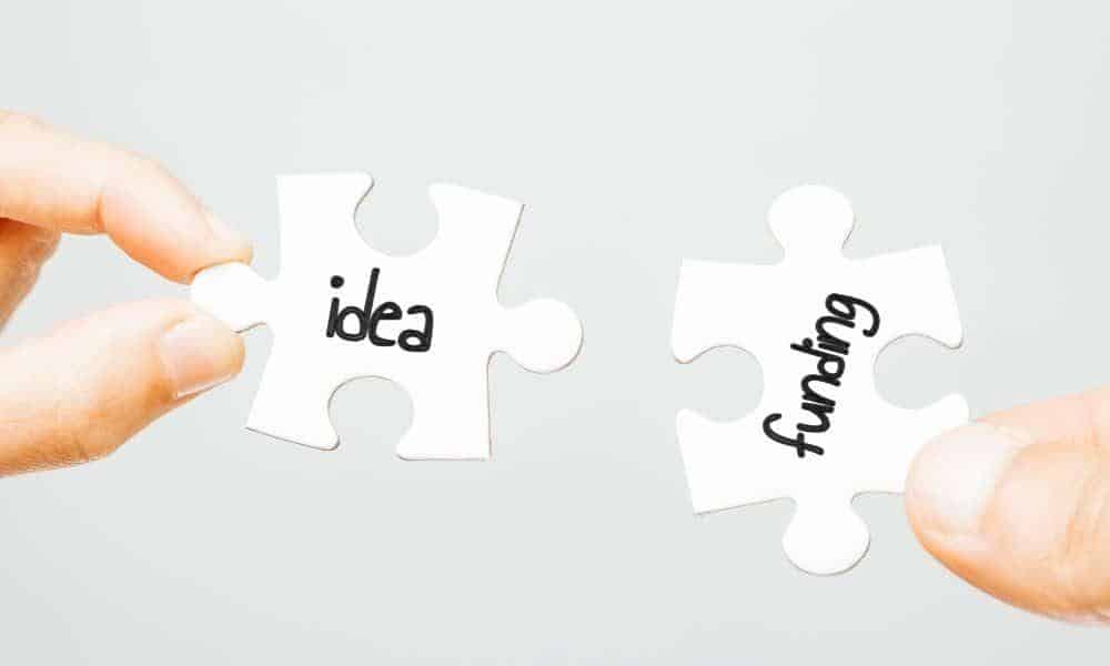 Puzzle Pieces In Hands