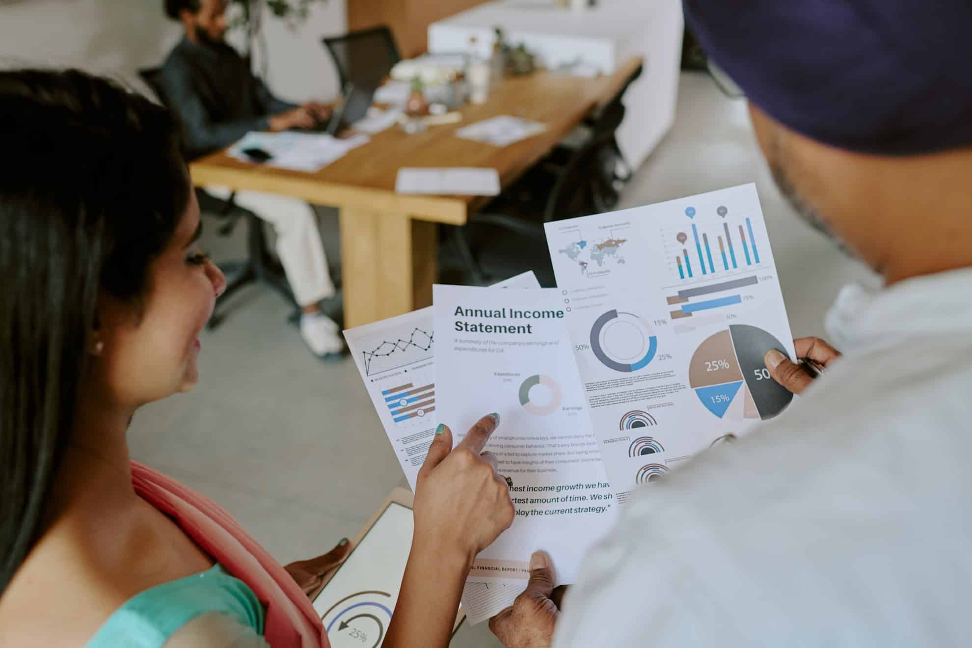 A woman looking at her business' annual year-over-year growth.