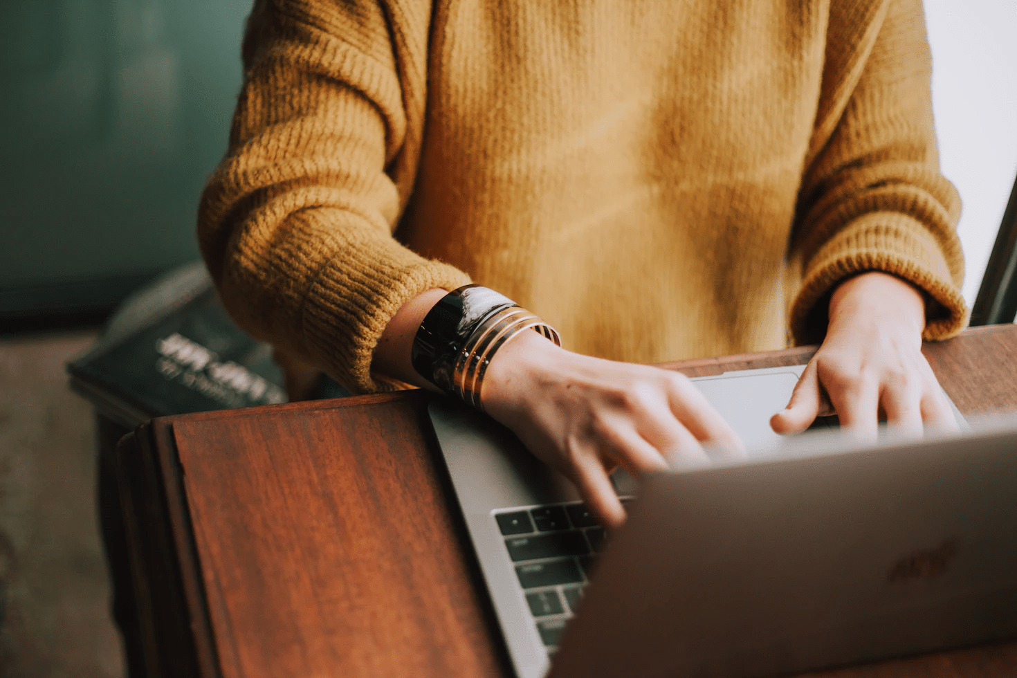 An image of an entrepreneur working on a MacBook.